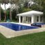 Aquamatic automatic pool cover installed on a backyard pool